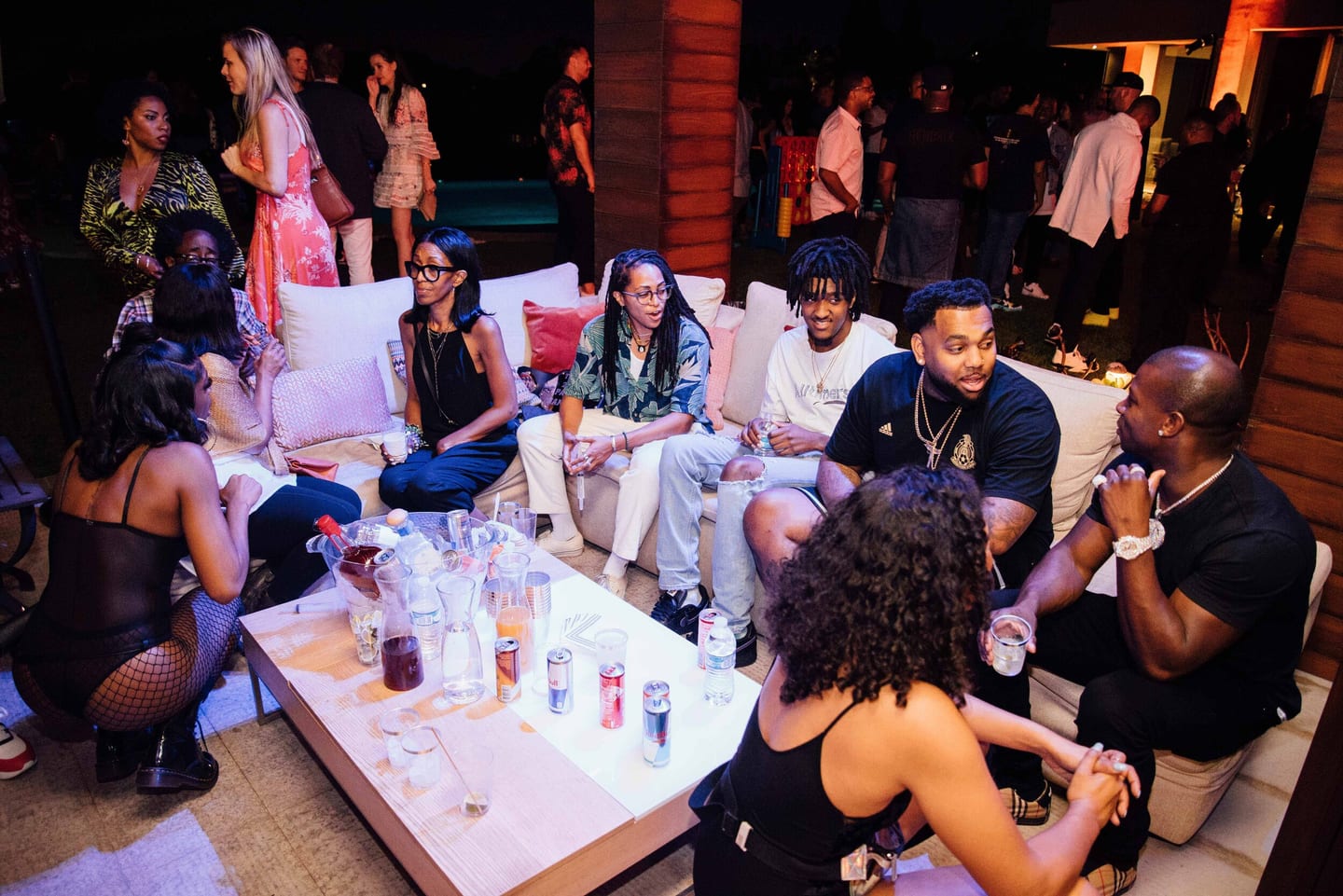 Group of guests around a bottle-service table in a lounge