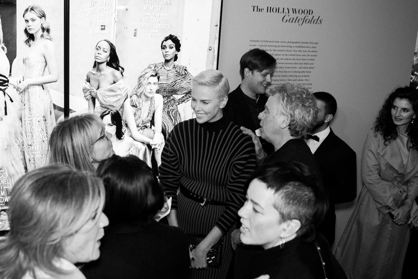 Charlize Theron greeting guests at the Vanity Fair Hollywood Calling exhibition opening at the Annenberg Space for Photography
