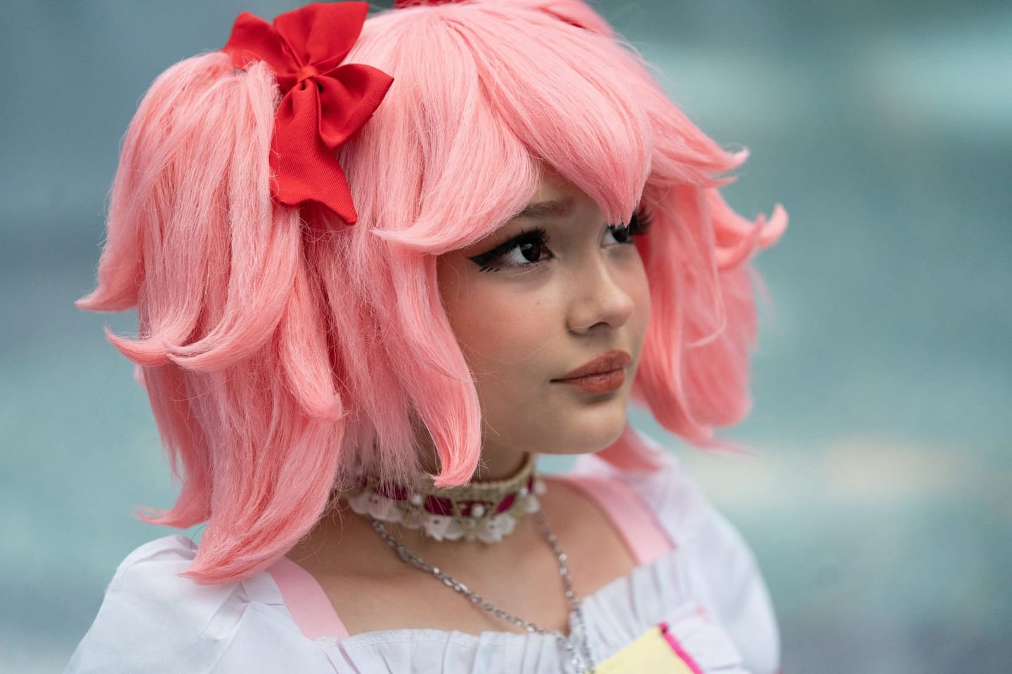 Creator in pink cosplay at a convention
