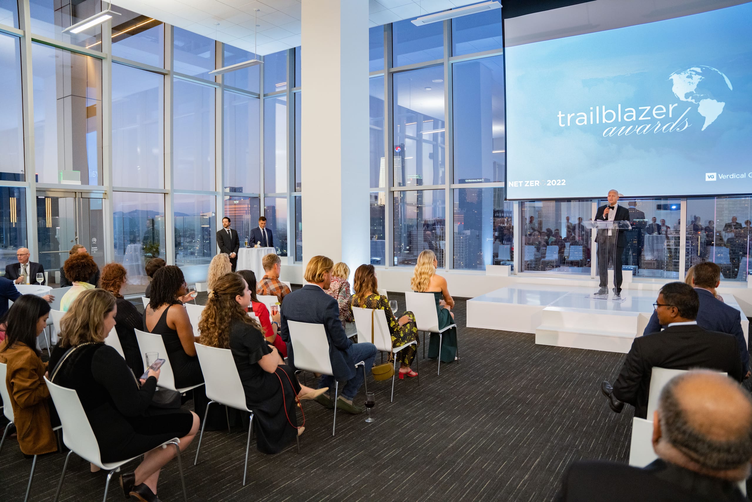Los Angeles corporate event photographer Kyle Espeleta covering a corporate awards ceremony in a glass-walled venue in downtown Los Angeles