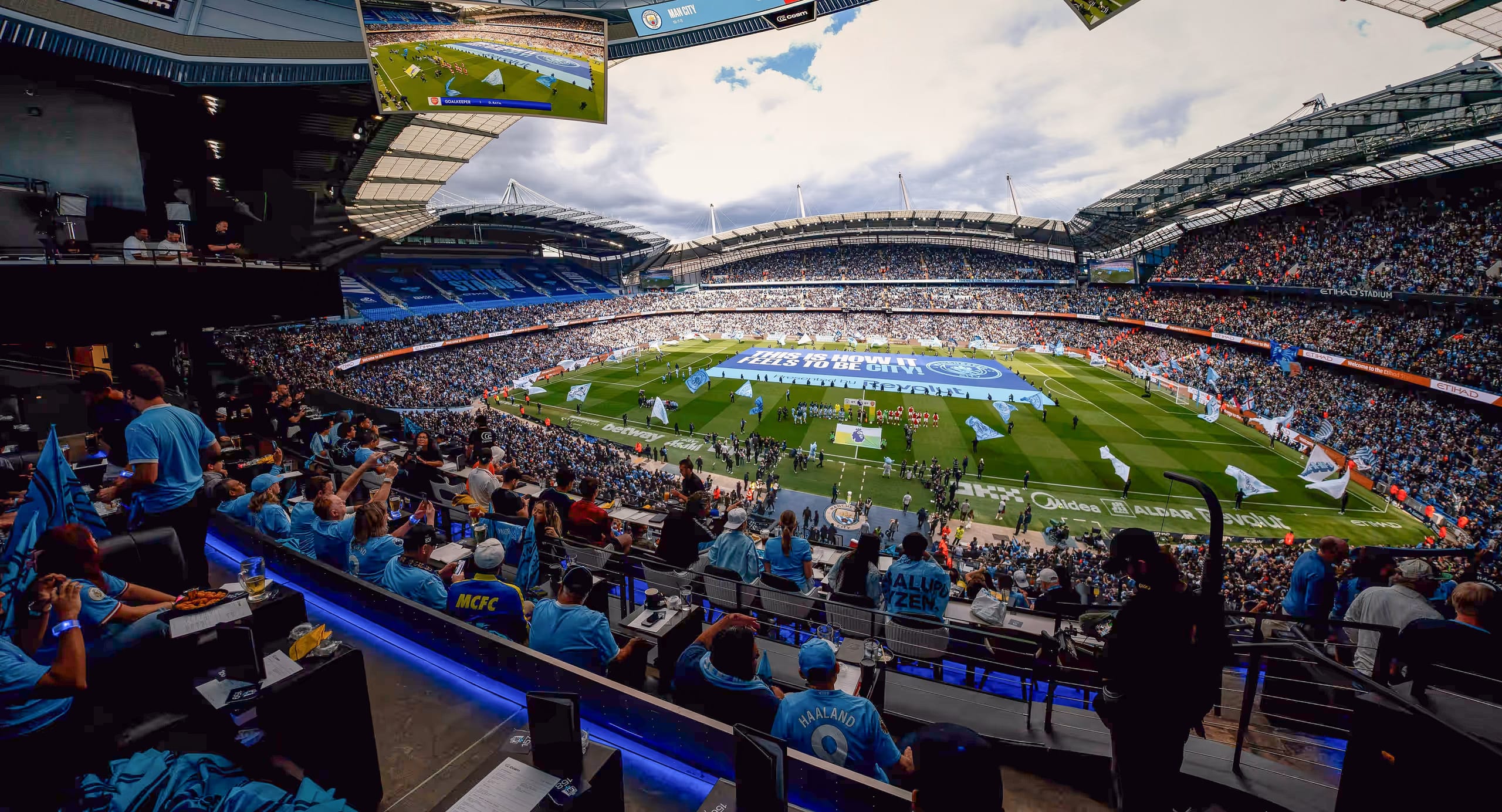 Manchester City supporters watching the Arsenal match on Cosm’s immersive stadium-scale screen in Inglewood