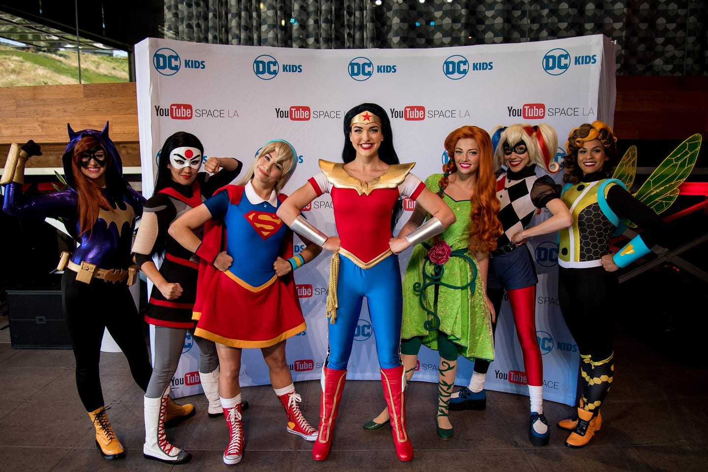 DC superhero cosplayers with kids at a DC event at YouTube Space Los Angeles
