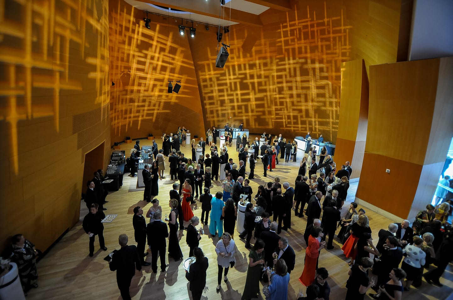 Guests mingling inside Walt Disney Concert Hall at an LA Philharmonic gala reception