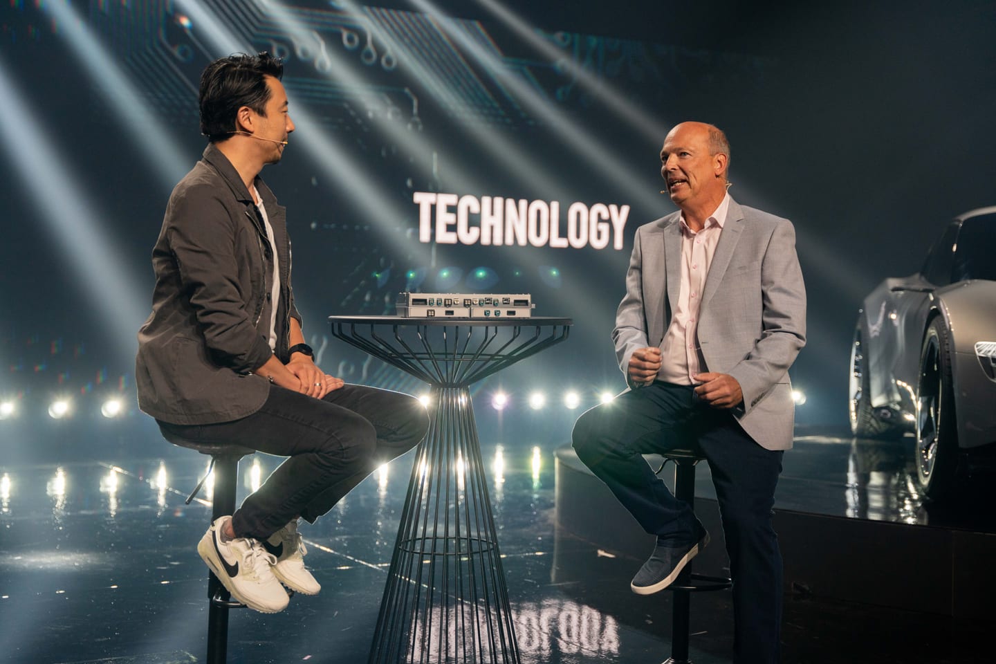 Two speakers on stools during the technology fireside chat