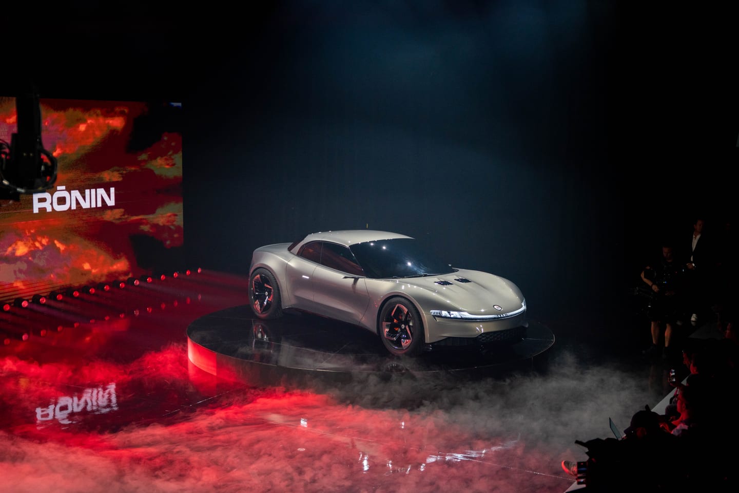 The Fisker Ronin on the turntable as photographers work the floor