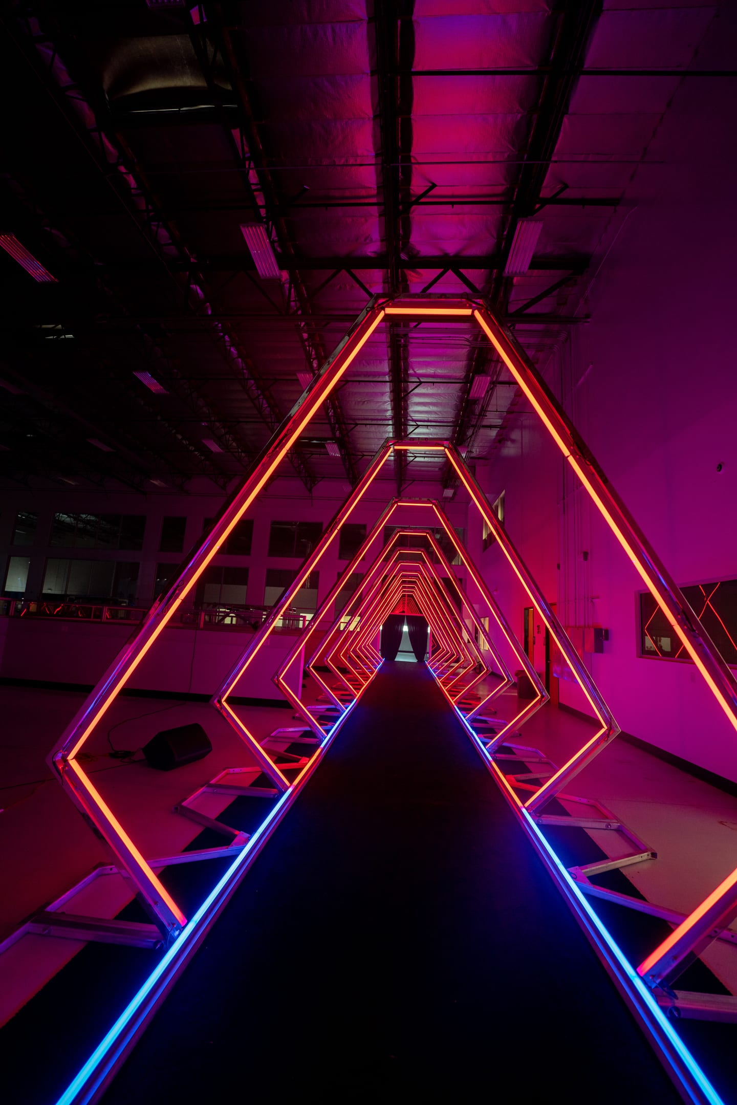 The empty neon tunnel activation in magenta light