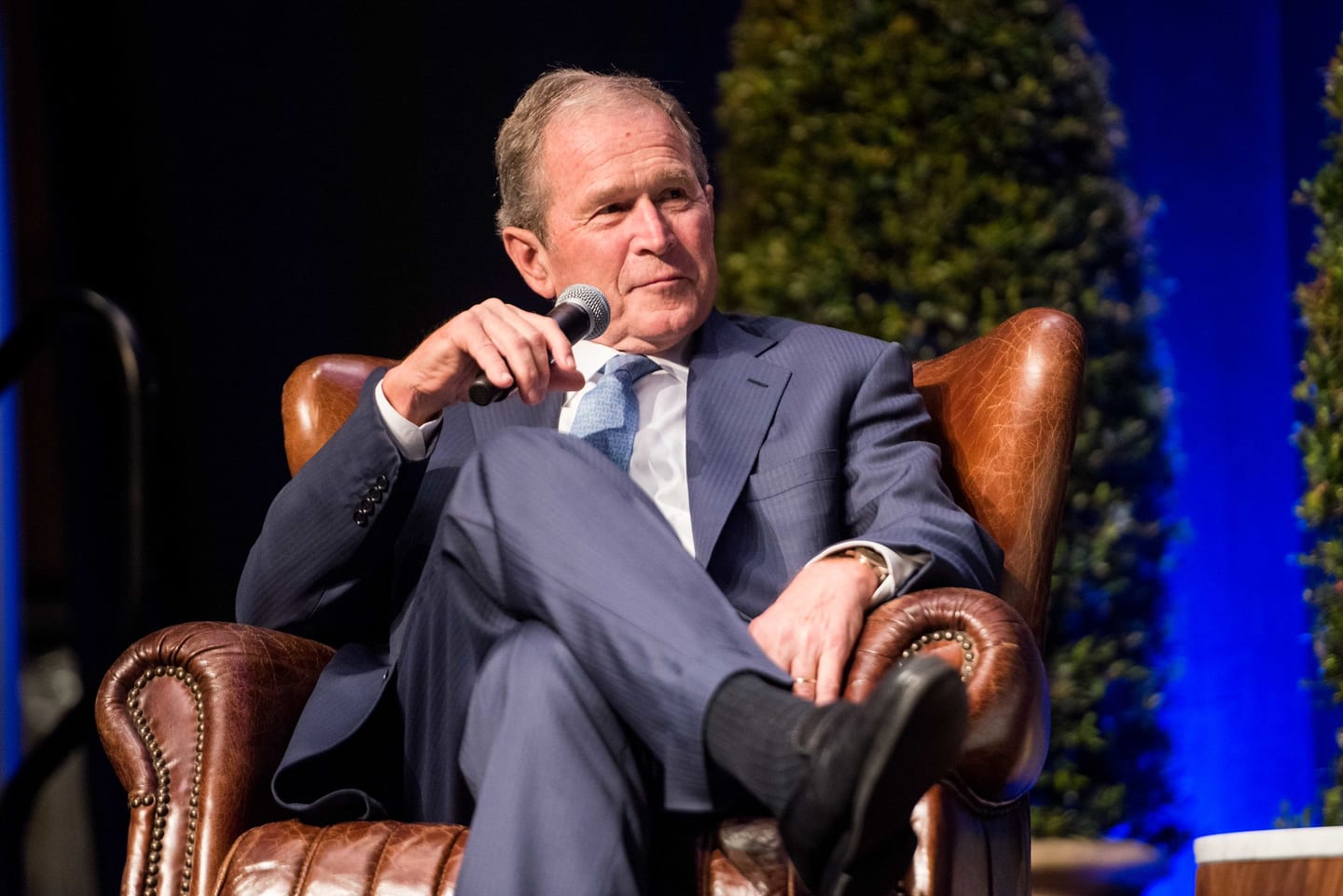 Former U.S. President George W. Bush seated on stage in conversation at a Pacific Council event in Downtown Los Angeles