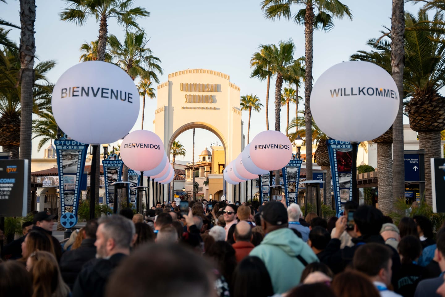 IPW delegates arriving at the closing party under the Universal Studios arch strung with welcome balloons in many languages