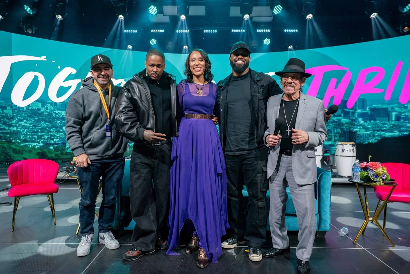 Speakers including Danny Trejo on stage at the JCOD Together We Thrive Summit and Festival in Inglewood