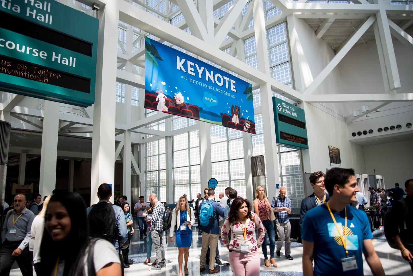 Attendees on escalators under a keynote banner in the LA Convention Center lobby