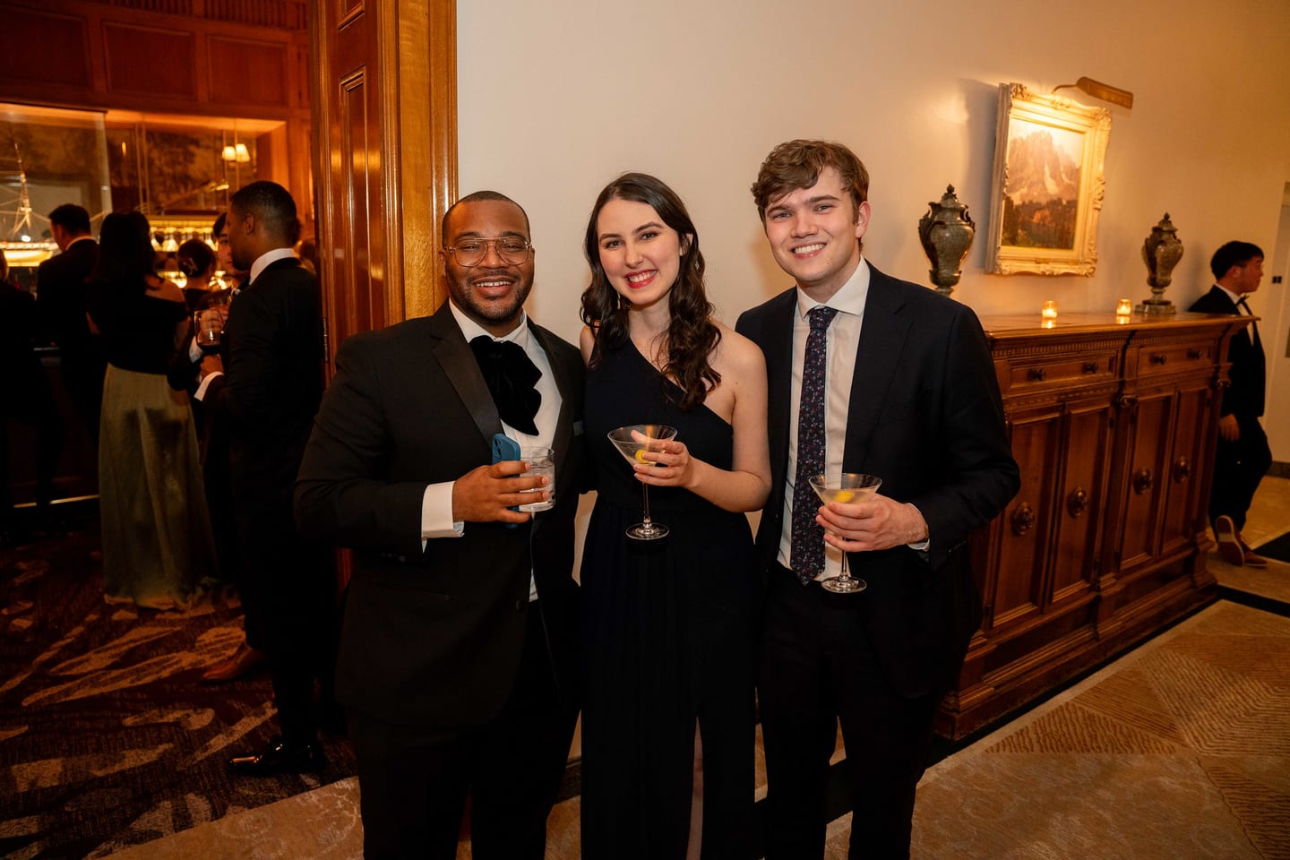 Three guests with martinis at a McKinsey & Company gala