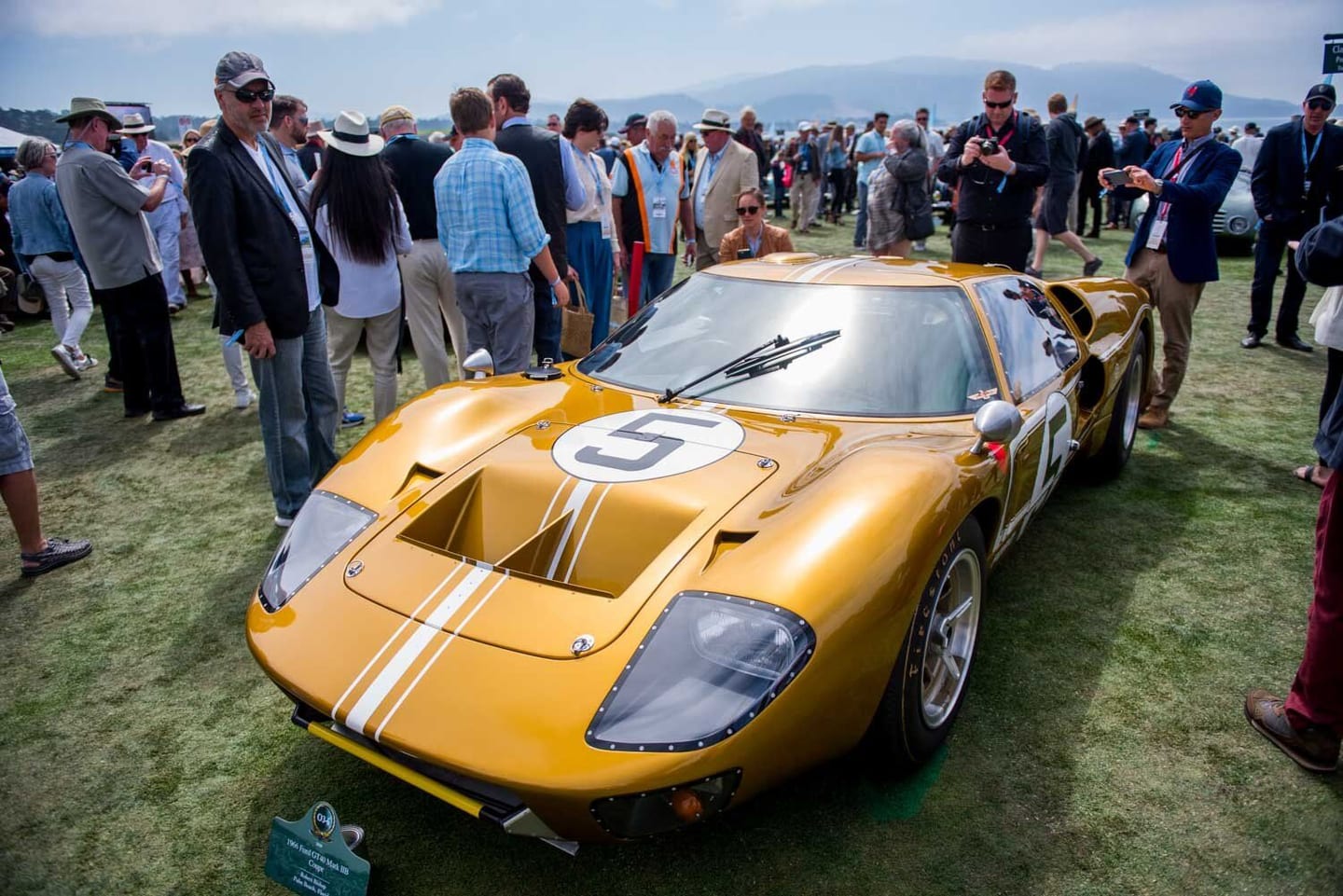 Gold Ford GT40 among the crowd on the lawn at Monterey Car Week, shot for Esquire