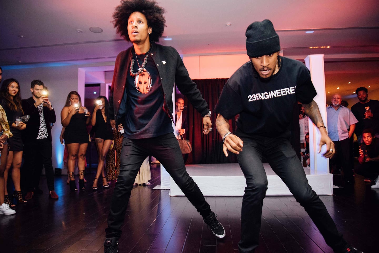 Two dancers performing for guests at a private party