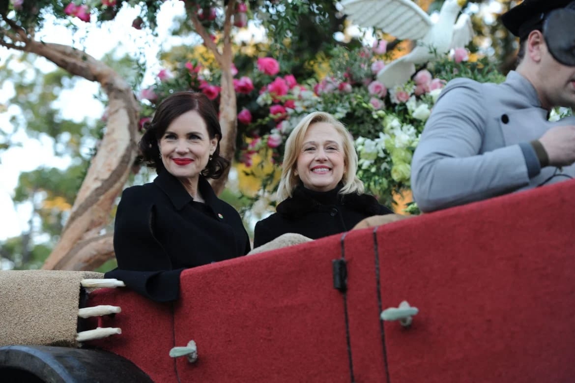 Elizabeth McGovern and Paula Kerger riding the Downton Abbey float at the Rose Parade, photographed for Current