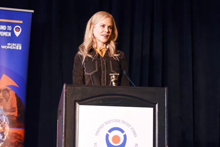 Nicole Kidman speaking at a UN Women podium, photographed for People magazine