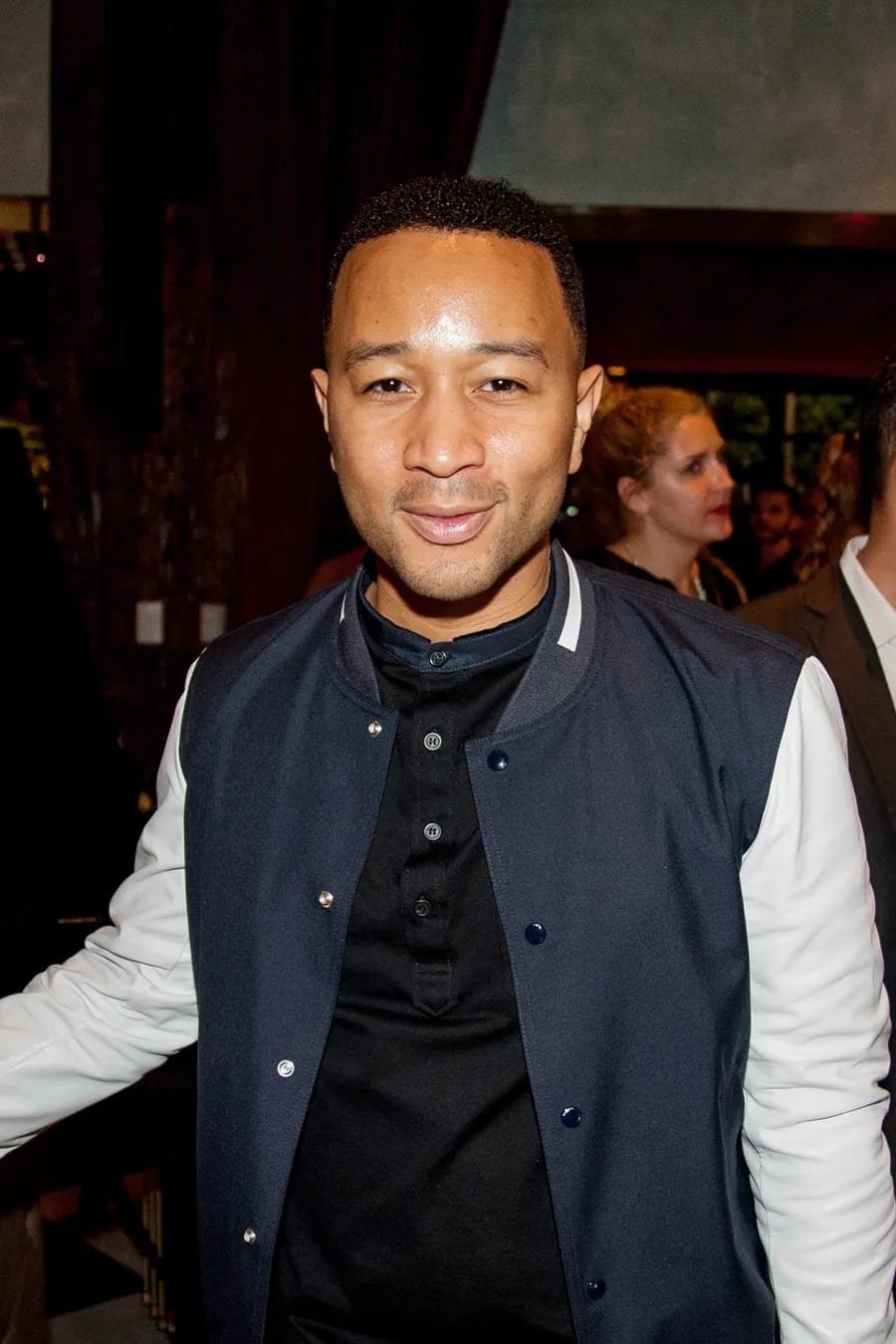 John Legend in a varsity jacket at a BET Awards party, photographed for The Cut