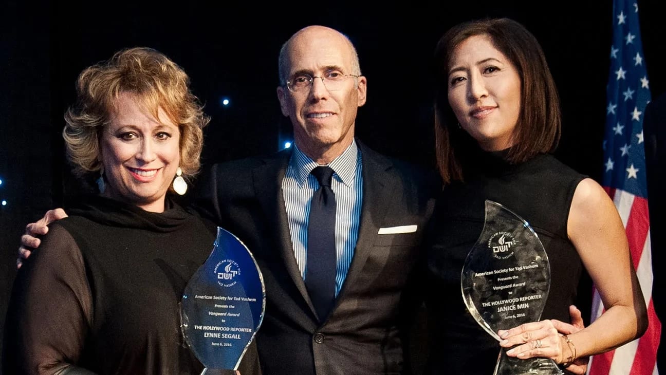 Jeffrey Katzenberg with Lynne Segall and Janice Min holding awards at the Yad Vashem gala, photographed for The Hollywood Reporter