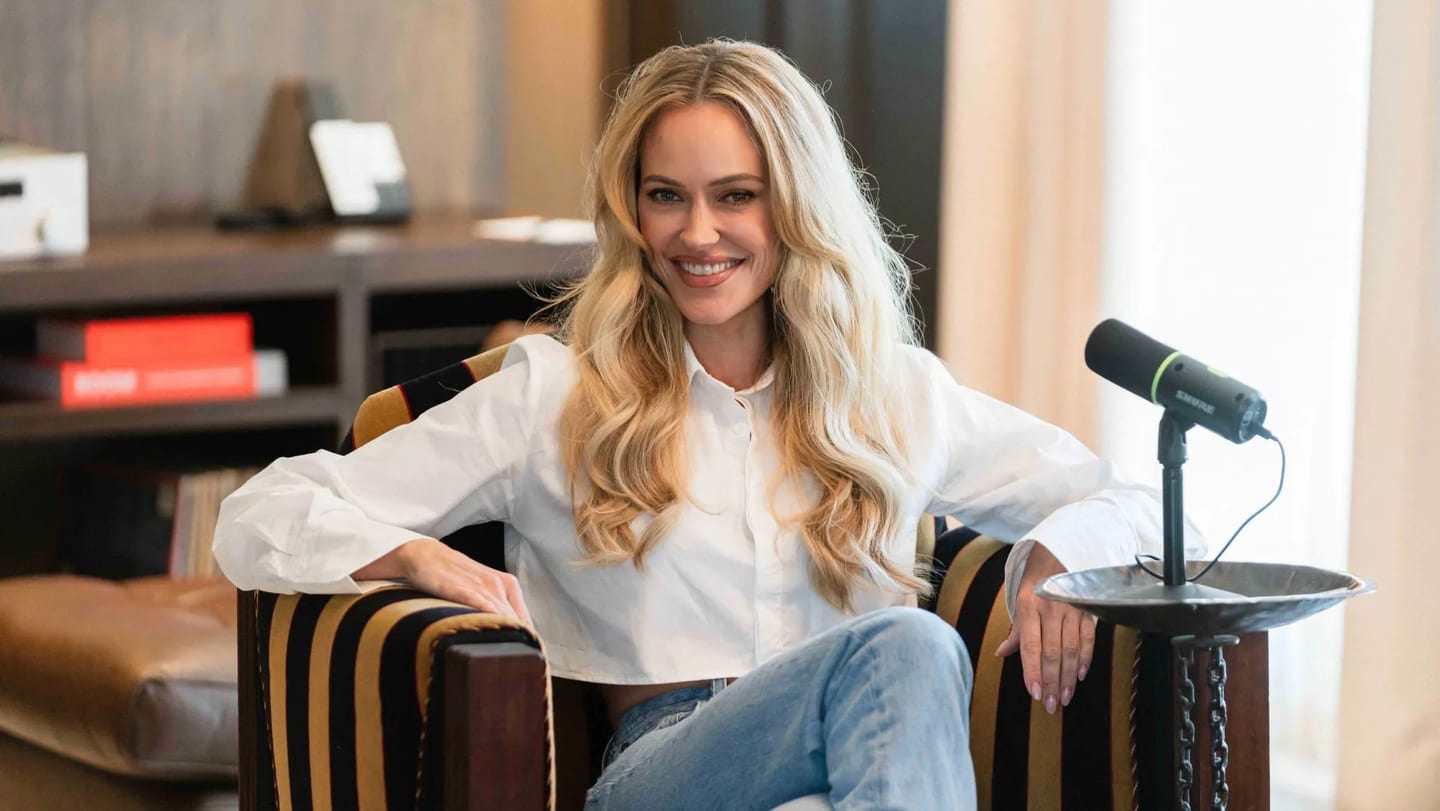 Peta Murgatroyd seated beside a podcast microphone at The Hollywood Roosevelt, photographed for The Hollywood Reporter
