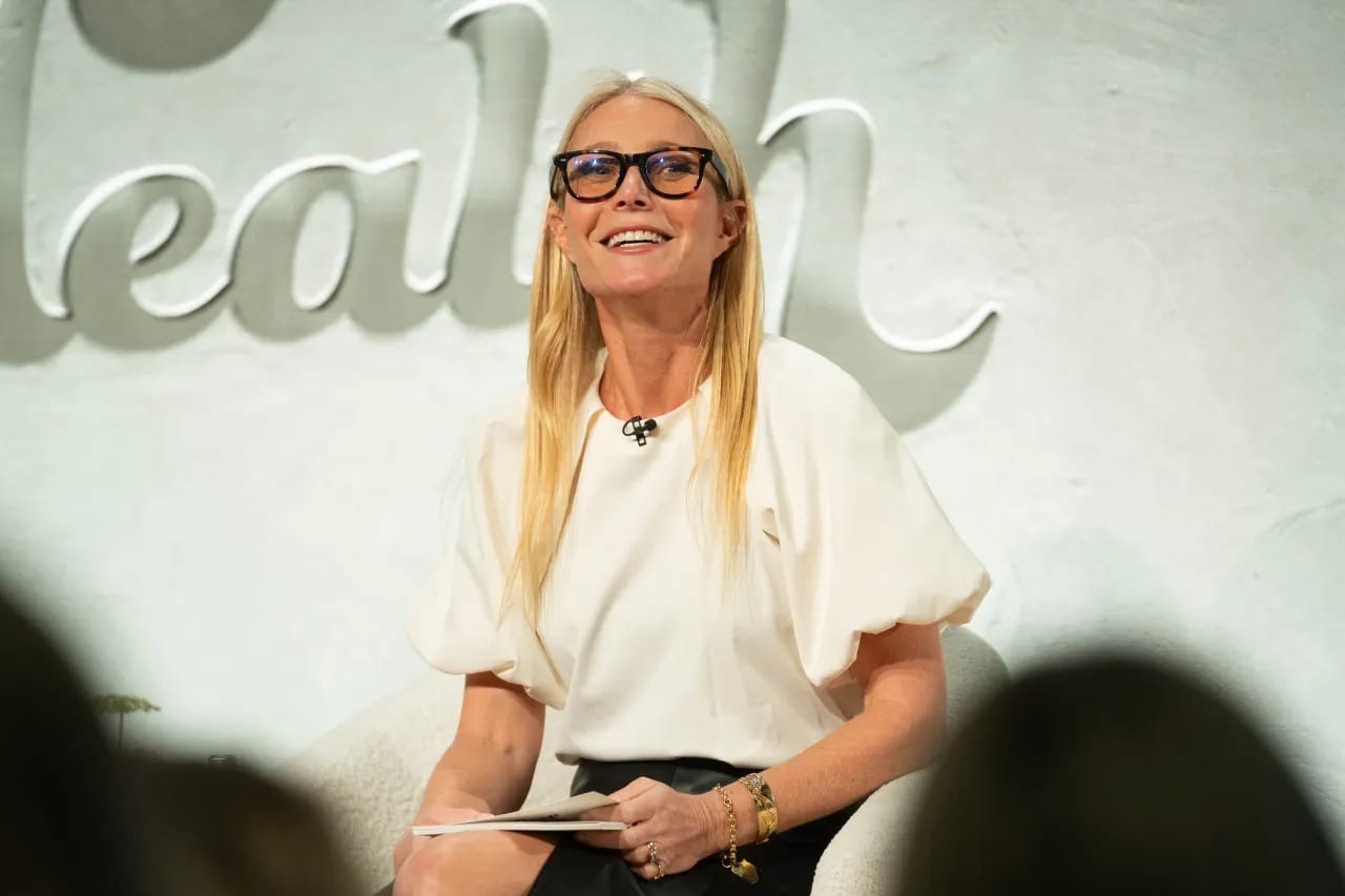 Gwyneth Paltrow seated on stage at the In Goop Health summit, photographed for Variety